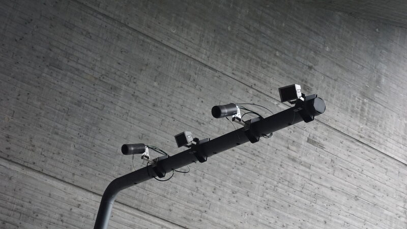 ANPR speed enforcement cameras mounted on a gantry inside a Norwegian road tunnel near the Hardangerbridge