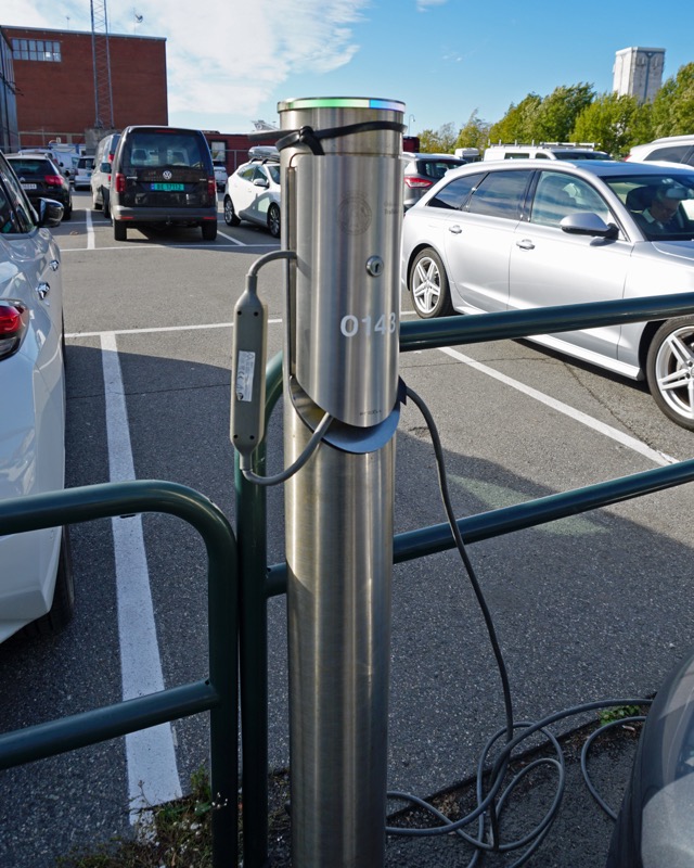 Electric vehicle charging poles at a parking lot in Oslo, Norway